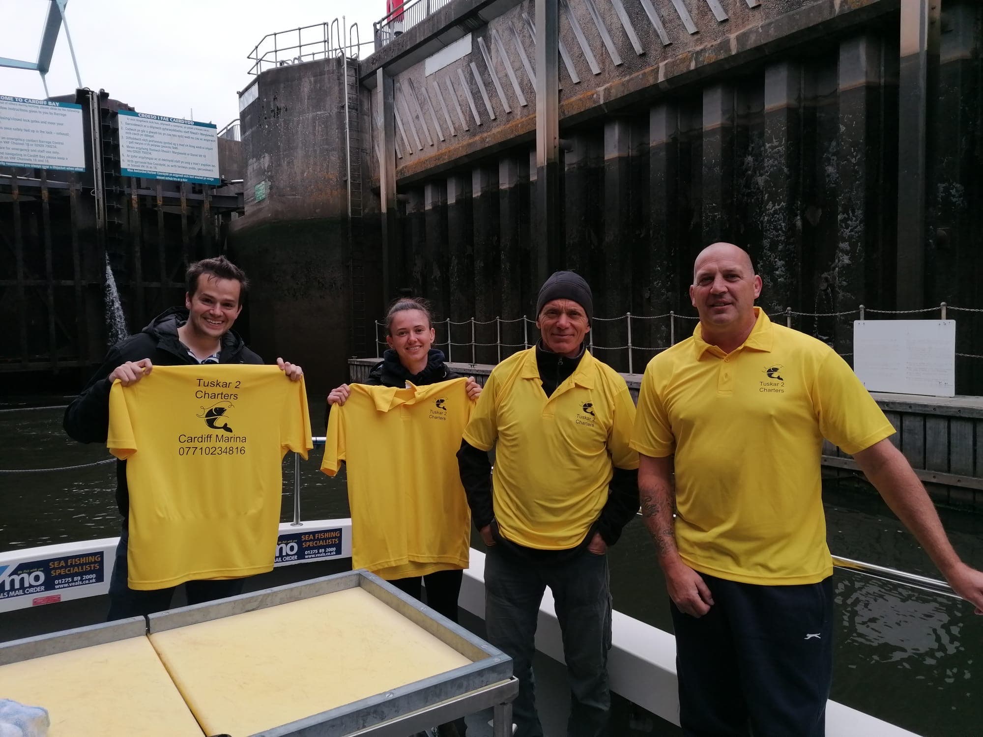 The Tuskar 3 crew in branded polos at Cardiff Bay lock